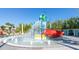 Fun splash pad with colorful water features, providing a safe and entertaining play area for children at 971 Paradise Dr, Davenport, FL 33897