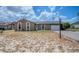 Single-story home with a lawn that requires landscape maintenance at 987 Trumbull St, Deltona, FL 32725