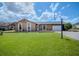 Charming single-story home featuring a well-manicured lawn and classic architectural details at 987 Trumbull St, Deltona, FL 32725