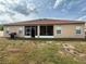 Backyard with screen door and grill, perfect for outdoor cooking and relaxation at 1029 Dampierre Ct, Kissimmee, FL 34759