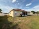Large backyard with partial fence and grill, great for outdoor activities and gatherings at 1029 Dampierre Ct, Kissimmee, FL 34759