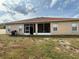 Backyard with screen door and grill, perfect for outdoor cooking and relaxation at 1029 Dampierre Ct, Kissimmee, FL 34759