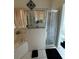 Bathroom featuring a soaking tub and a glass enclosed shower at 1029 Dampierre Ct, Kissimmee, FL 34759