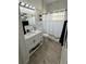 Bright bathroom featuring a modern vanity, a toilet, and tiled floors, creating a functional space at 1029 Dampierre Ct, Kissimmee, FL 34759