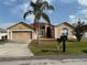 Charming single-story home featuring a well-manicured lawn and a classic mailbox at 1029 Dampierre Ct, Kissimmee, FL 34759