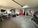 Organized garage with storage shelves, and ample space for vehicles and equipment at 1029 Dampierre Ct, Kissimmee, FL 34759