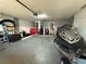 Spacious garage with ample storage space, concrete flooring, and a jetski ready for summer fun at 1029 Dampierre Ct, Kissimmee, FL 34759