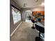 Bright kitchen features a tile floor, wooden cabinets, and a view into the dining area at 1029 Dampierre Ct, Kissimmee, FL 34759