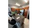 Cozy kitchen featuring granite countertops, wood cabinets, and stainless steel appliances at 1029 Dampierre Ct, Kissimmee, FL 34759