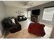 Cozy living room with comfortable seating and a fireplace, perfect for relaxation at 1029 Dampierre Ct, Kissimmee, FL 34759