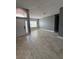 Spacious living room featuring large window and tiled flooring, perfect for comfort at 1029 Dampierre Ct, Kissimmee, FL 34759