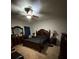 Main bedroom featuring a ceiling fan, carpet, and a full set of matching furniture at 1029 Dampierre Ct, Kissimmee, FL 34759