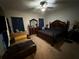 Main bedroom featuring a ceiling fan, carpet, and a full set of matching furniture at 1029 Dampierre Ct, Kissimmee, FL 34759