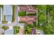 Aerial view of homes with landscaped yards and tile roofs in a residential neighborhood at 1047 Banks Rose St, Kissimmee, FL 34747