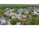 An aerial shot showcasing a charming neighborhood with mature trees and diverse homes at 1047 Banks Rose St, Kissimmee, FL 34747