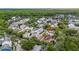An aerial shot showcasing a charming neighborhood with mature trees and diverse homes at 1047 Banks Rose St, Kissimmee, FL 34747