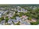 Charming neighborhood with mature trees and well-maintained homes from an aerial view at 1047 Banks Rose St, Kissimmee, FL 34747