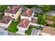 Bird's-eye view of homes with well-kept yards and tile roofs in a suburban area at 1047 Banks Rose St, Kissimmee, FL 34747
