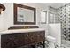 Elegant bathroom with a unique vanity, statement mirror, and a modern star-patterned shower at 1047 Banks Rose St, Kissimmee, FL 34747