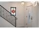 Entryway area with black metal railing and a unique stained glass window at 1047 Banks Rose St, Kissimmee, FL 34747