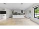 Open concept kitchen with white cabinets, granite countertops, and stainless steel appliances at 1047 Banks Rose St, Kissimmee, FL 34747