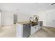 Kitchen island features seating, granite countertops, stainless steel appliances and a bronze sink at 1047 Banks Rose St, Kissimmee, FL 34747