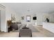 Open living room with modern furnishings, neutral colors, and easy access to the kitchen at 1047 Banks Rose St, Kissimmee, FL 34747