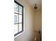 Hallway featuring a staircase and decorative ceiling light fixture with a large window at 1047 Banks Rose St, Kissimmee, FL 34747