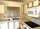 Bright kitchen with modern appliances, laminate countertops, and ample cabinet space at 108 Creekside Way, Orlando, FL 32824