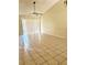 Spacious living room features tile floors, ceiling fan, and sliding glass door at 108 Creekside Way, Orlando, FL 32824