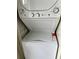 Stacked washer and dryer unit in white, perfect for saving space in laundry area at 108 Creekside Way, Orlando, FL 32824
