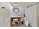 Bathroom featuring stylish patterned flooring, a vessel sink, shiplap accent wall, and a shower with a curtain at 1211 Celebration Ave # 102, Celebration, FL 34747