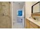 Clean bathroom with tile flooring, shower, and a view into the bedroom at 1211 Celebration Ave # 102, Celebration, FL 34747