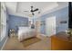Cozy bedroom with a comfortable bed, ample natural light, and serene blue walls, perfect for relaxation at 1211 Celebration Ave # 102, Celebration, FL 34747