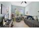 Comfortable bedroom featuring neutral walls, natural light, and a cozy sleeping space at 1211 Celebration Ave # 102, Celebration, FL 34747