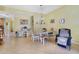 Bright dining room with a wooden table, bench, and comfortable seating, perfect for Gathering meals and gatherings at 1211 Celebration Ave # 102, Celebration, FL 34747
