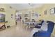 Open-concept dining room with casual seating area, seamlessly connected to the kitchen and living spaces at 1211 Celebration Ave # 102, Celebration, FL 34747