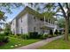 Charming two-story home features a beautiful balcony, landscaped yard, and inviting curb appeal at 1211 Celebration Ave # 102, Celebration, FL 34747