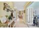 Hallway view showcasing decor, tile flooring, and a view of kitchen with breakfast bar seating in the distance at 1211 Celebration Ave # 102, Celebration, FL 34747