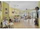 Spacious living room with ample natural light, featuring a comfortable sofa and seamless access to the dining area at 1211 Celebration Ave # 102, Celebration, FL 34747