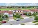 Aerial view of a neighborhood showcasing beautiful Mediterranean homes, lush golf course, and community at 13136 Alderley Drive Dr, Orlando, FL 32832