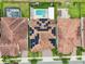 Overhead shot of a home with solar panels, a private pool, a well-maintained lawn, and outdoor recreation space at 13136 Alderley Drive Dr, Orlando, FL 32832