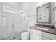 Modern bathroom with a walk-in shower, gray countertop, and tiled floor at 13136 Alderley Drive Dr, Orlando, FL 32832