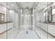 Lavish bathroom with a glass-enclosed marble shower and modern vanity at 13136 Alderley Drive Dr, Orlando, FL 32832