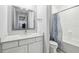 Bathroom features a vanity with a sink and a tub with a shower at 13136 Alderley Drive Dr, Orlando, FL 32832