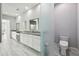 Bathroom featuring double vanity, ample counter space, and a separate toilet area at 13136 Alderley Drive Dr, Orlando, FL 32832