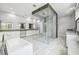 Elegant bathroom with a glass-enclosed shower, soaking tub, and double vanity sinks at 13136 Alderley Drive Dr, Orlando, FL 32832