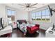 Light-filled bedroom with hard wood floors and large windows offering a scenic view at 13136 Alderley Drive Dr, Orlando, FL 32832