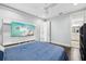 Neutral bedroom features a large flat screen TV with ensuite bathroom at 13136 Alderley Drive Dr, Orlando, FL 32832