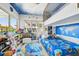 Bright bedroom features a lofted bed with fun Paw Patrol themed decor and a playful space-themed ceiling at 13136 Alderley Drive Dr, Orlando, FL 32832